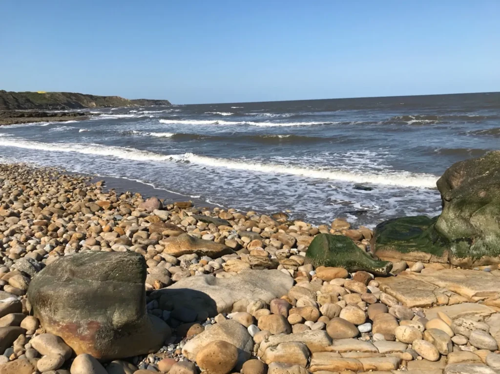 A pebble beach on the Yorkshire Coast, near our dog friendly holiday cottage in Scarborough, North Yorkshire.